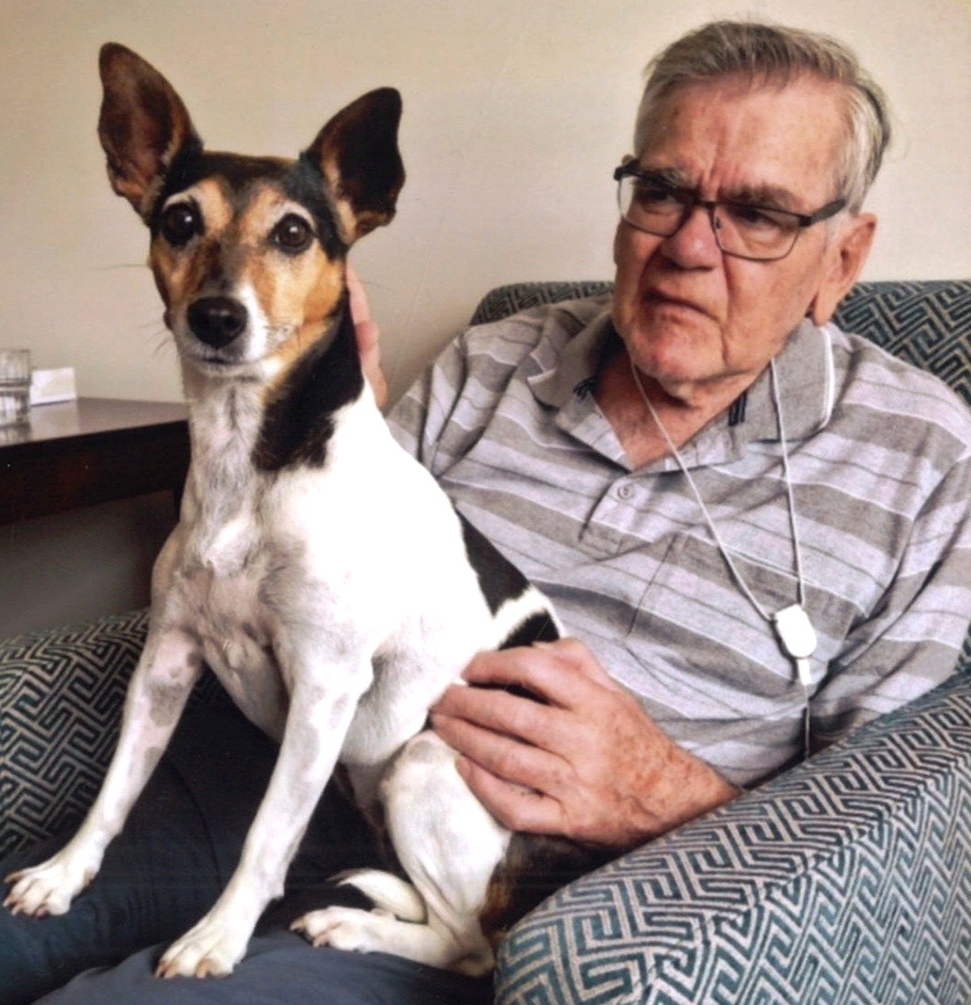 Elderly man with his small dog
