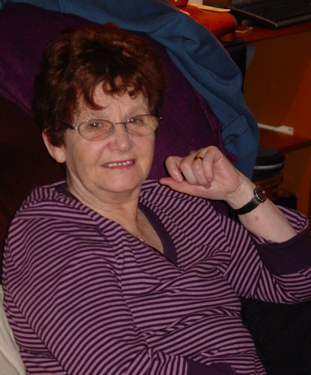 Woman smiling while relaxing at home